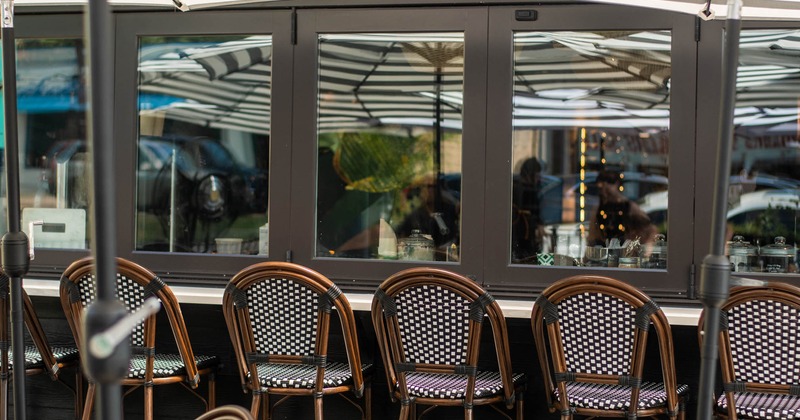 Exterior, tables, chairs and stools ready for guests