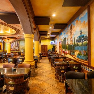 Restaurant's interior with tables, chairs and wall decorations.