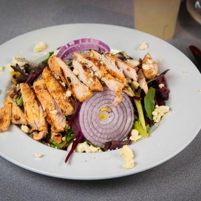 Michigan salad topped with bleu cheese, onion, walnuts and grilled chicken.