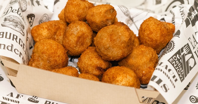 Jalapeno poppers in a takeout box
