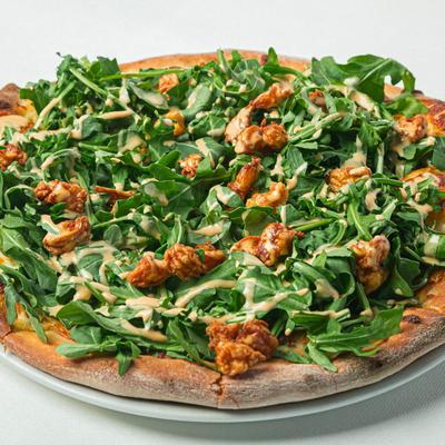 Pizza with mozzarella, shrimp, arugula, and pink lobster aioli.