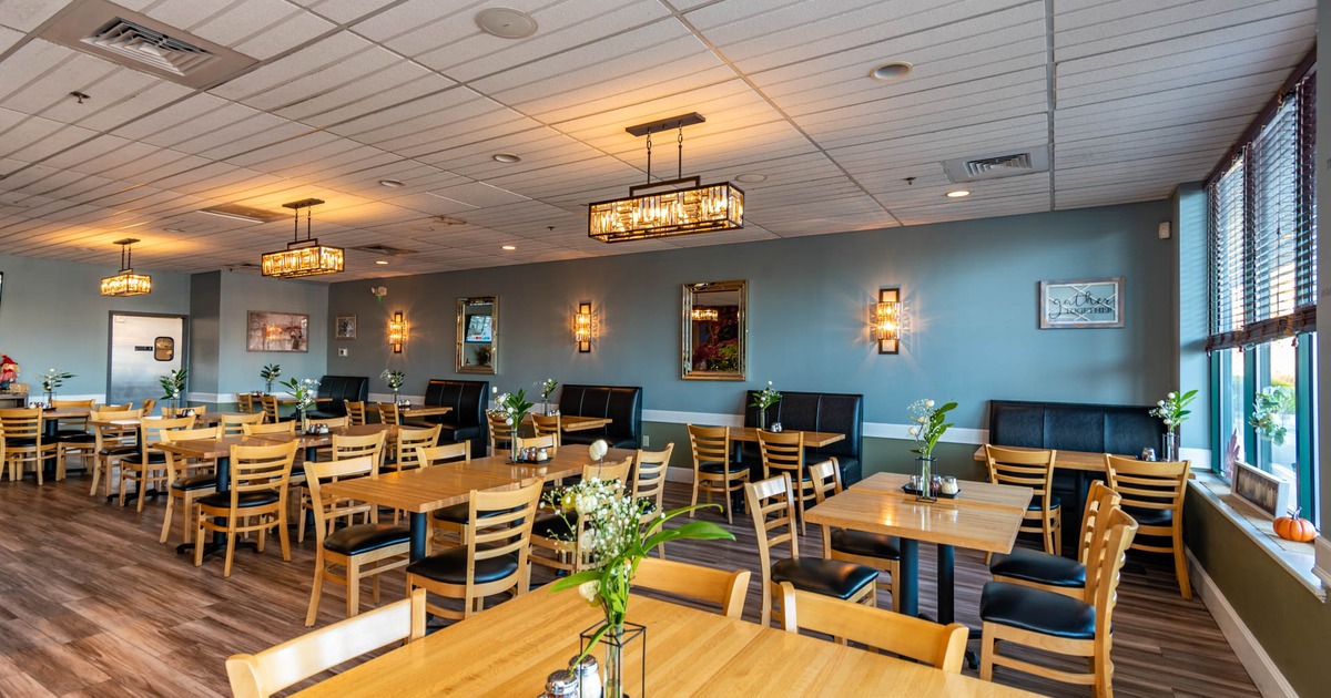 Interior, tables ready for guests, wall decorations