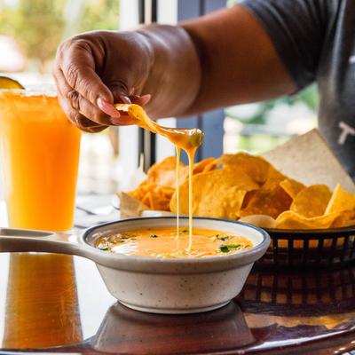 Cheese dip and tortilla chips.