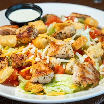 Close up shot of Chicken Caesar salad.