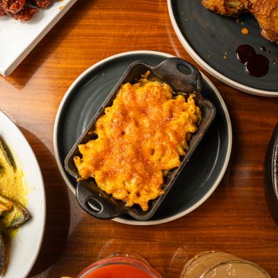 Macaroni and cheese served in a cast-iron skillet, overhead view.
