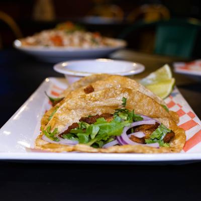 Fried fish tacos, with red onion and cilantro.