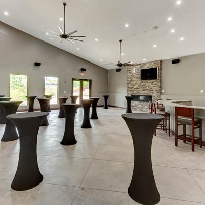 High-top tables in an event hall.