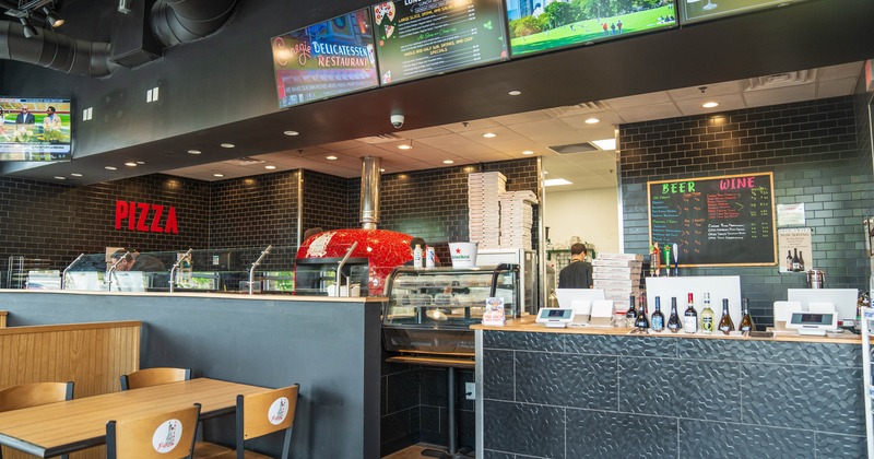 Diner counter, tv screens above, booths