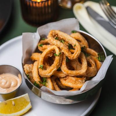 Fried calamari, served, top view.