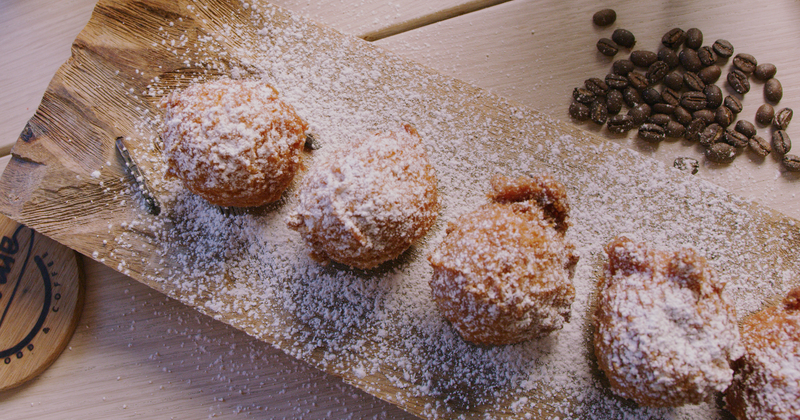 Beignets topped with powdered sugar