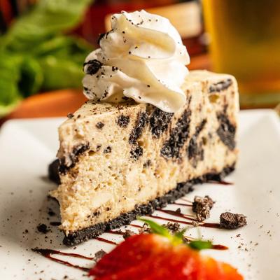 A piece of Oreo Cheesecake served