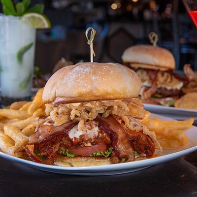 Bacon cheeseburger with blue cheese, and fries.