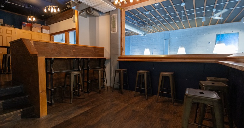 Upper floor, gallery, bar stools and tables