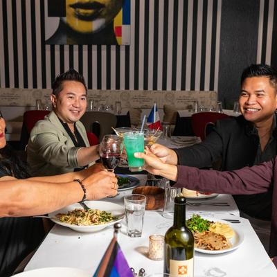 People enjoying a meal together at a restaurant table.