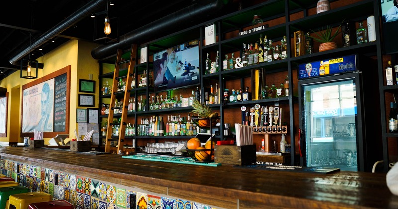 Bar, rich drink rack, tv's above