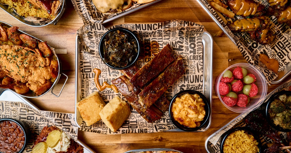 Barbecue ribs served with cornbread, mac and cheese, greens