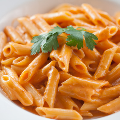 Penne pasta in creamy pink vodka sauce.