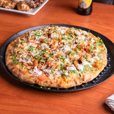 Samosa chaat pizza with Indian triangle potatoes turnover.