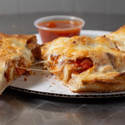 Pepperoni Calzone, with marinara sauce.
