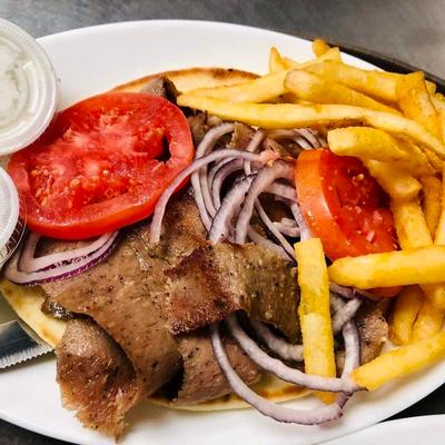 Gyros with side of fries abd dipps.