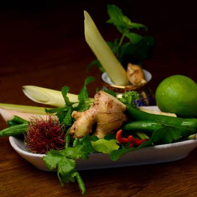 A collection of fresh ingredients used to prepare dishes like Tom Yum soup.