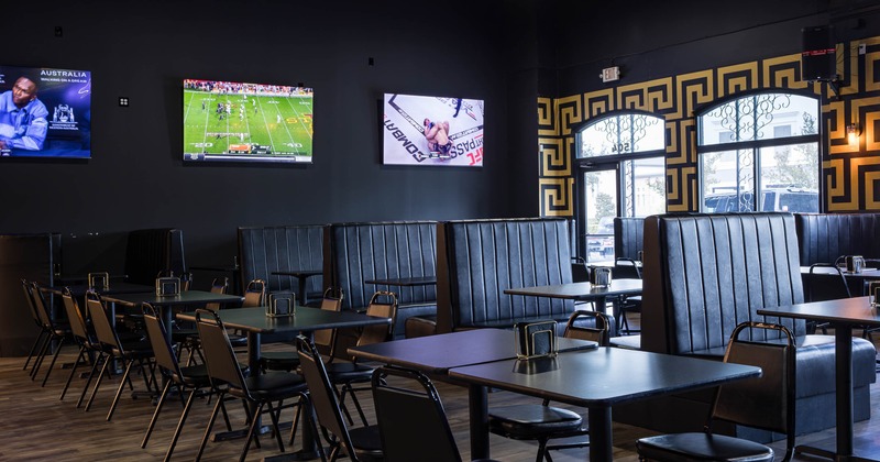 Interior, dining area, tables for four, leather padded seating booths with tables