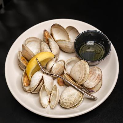 Steamed clams with lemon wedge and drawn butter.