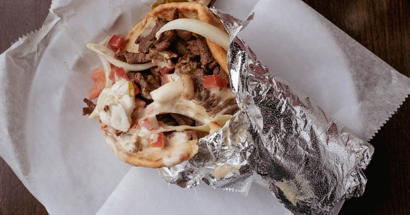 Lamb Shawarma with tomatoes, onion and tahini sauce