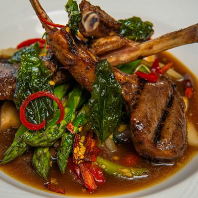 Basil Lamb Chops with garlic, onion, mushroom and Thai chil, close-up.