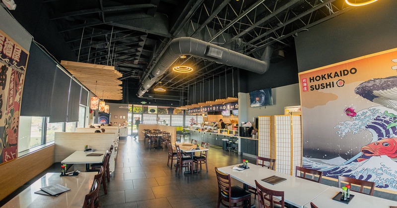 Interior of spacious sushi restaurant dining area