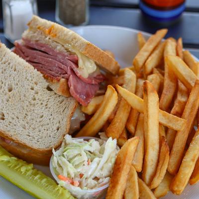 Ryan's Reuben served with fries, a pickle spear and slaw.