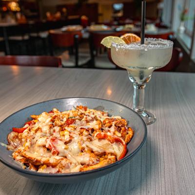 Skinny Margarita and a bowl of fajita with chicken.