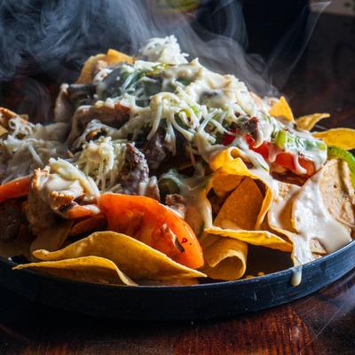 Grilled nachos chicken, served hot.