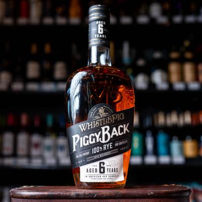 A bottle of Whistle Pig Piggy Back 100% Rye whiskey.
