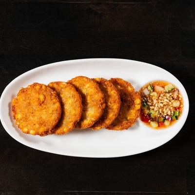 Crispy corn patties, served with sweet cucumber and peanut sauce.