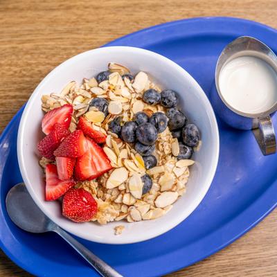 Oatmeal Bowl with Berries, almonds and milk.