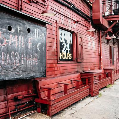 Exterior, benches next to bar