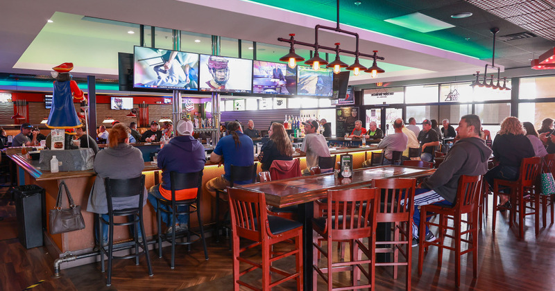 Restaurant interior, guests enjoying drinks