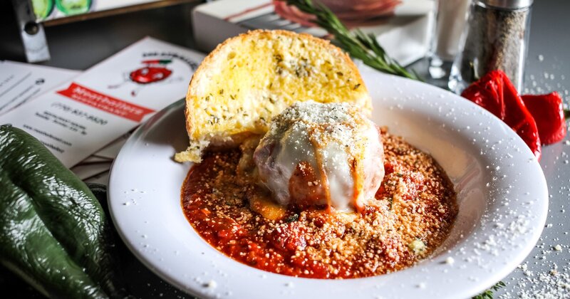 A meatball served in sauce