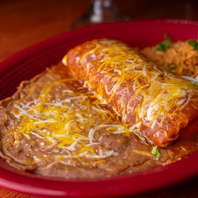 Los Gallitos Burrito with rice and refried beans on the side.