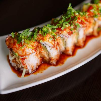 Sushi rolls in spicy sauce.