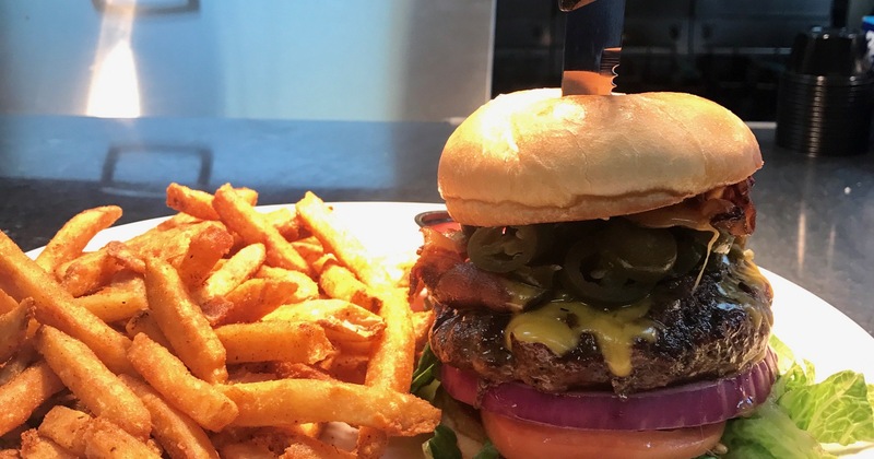 Jalapeno Popper Burger with a side of fries