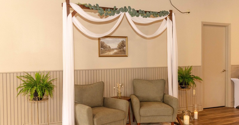 Interior, armchairs near wall with picture