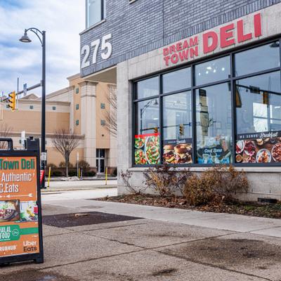 Dream Town Deli exterior with large windows and an outdoor sign.