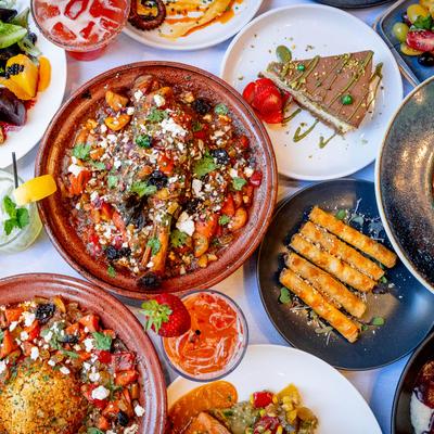 Colorful spread of assorted dishes and drinks.