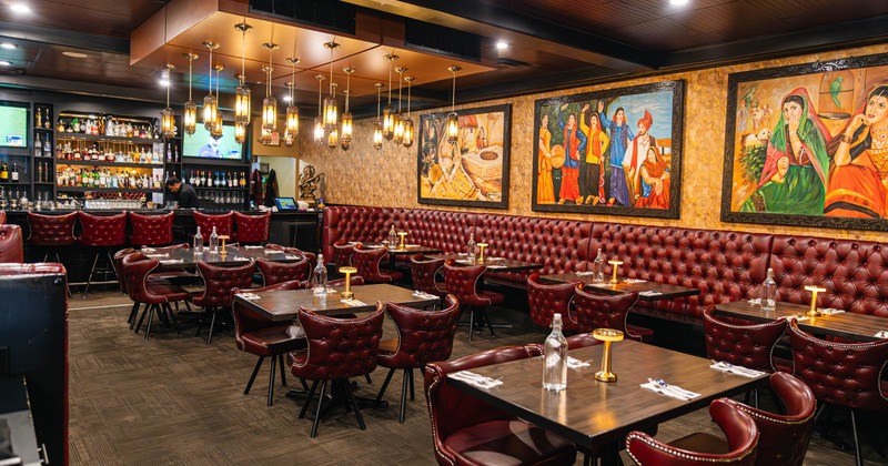 Interior, dining area, leather padded banquette bench and chairs, wooden top tables