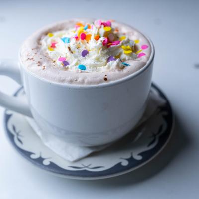 Hot chocolate with whipped cream and sprinkles.