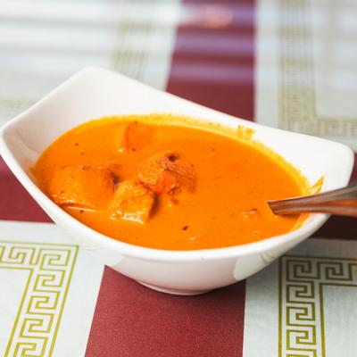 Chicken tikka masala in a white bowl.