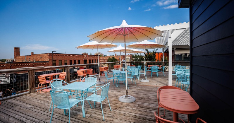 Outside, dining tables and chairs, parasols