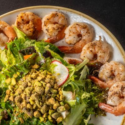 Mixed greens salad with shrimp, top view